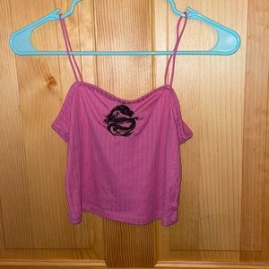 Pink cropped tank top with a dragon on it